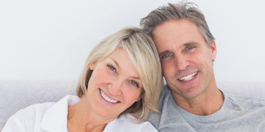 couple smiling | dental implants dedham ma